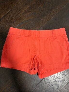 J. Crew orange shorts.